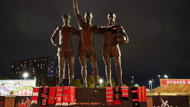 Tributes left on the United Trinity statue at Old Trafford following the announcement of the death of Sir Bobby Charlton in Manchester Britain 21 October 2023